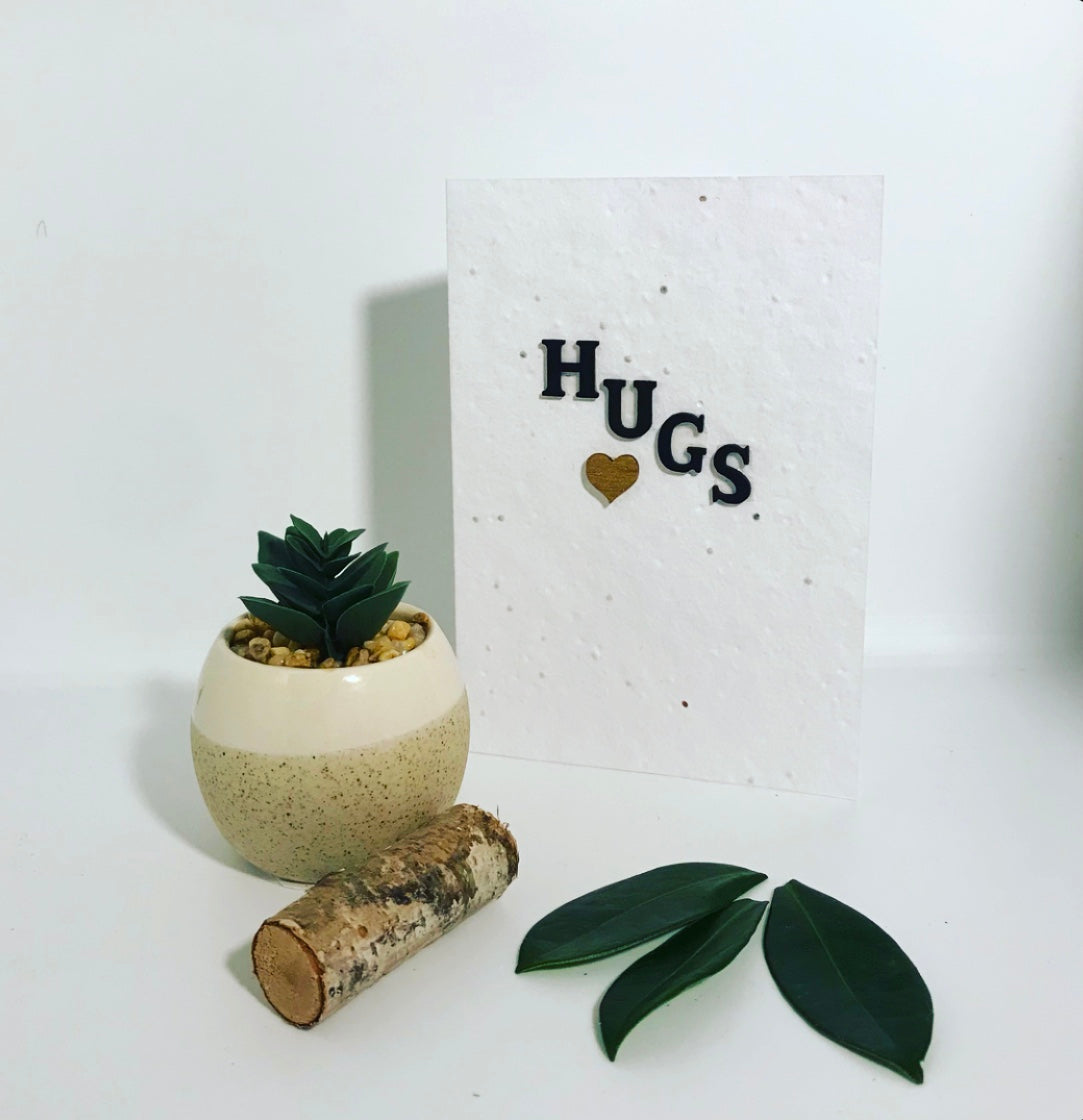 Seeded, plantable greeting card. With hand painted, wooden 'hugs'motif .