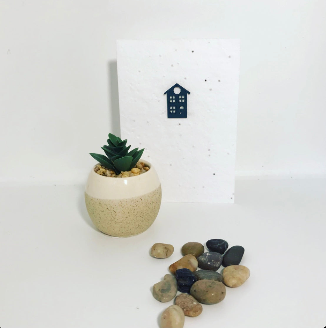 Seeded, plantable greeting card. With hand painted, green, wooden 'house' motif on embossed background