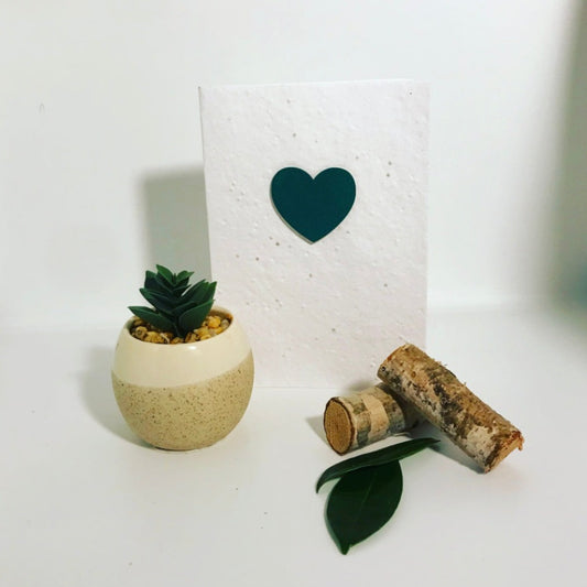 Seeded, plantable greeting card. Embellished with hand painted green heart motif .